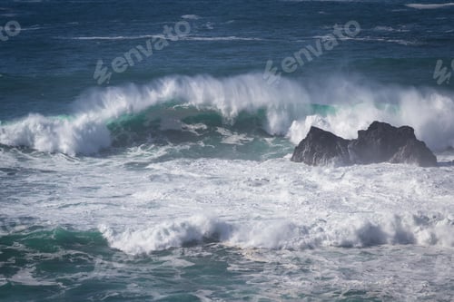 Preview: Beautiful Splashing Waves As They Crash Against This Large Boulders In The California Coast