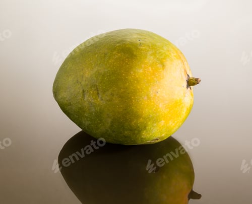 Preview: One Whole Round Mangoes Or Mango On Reflecting Glass Surface With Gradient