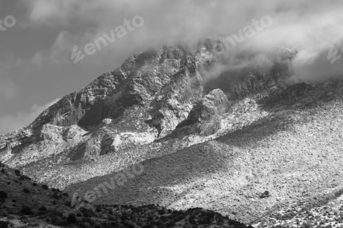 Preview: Snow And Cloud Capped Mountains In Black And White