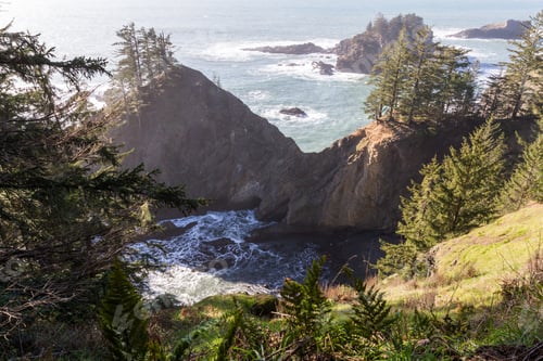 Preview: Evergreen Trees And Rocky Cliffs All Around The Natural Bridge Feature In The Samuel H Boardman