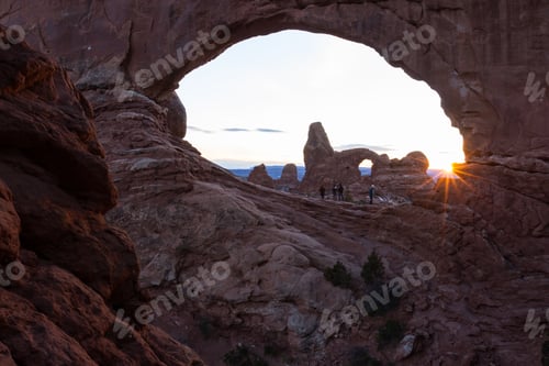 Preview: Arches National Park, Utah - December 28: Tourist Enjoying A Beautiful Sunset Behind Turret Arch