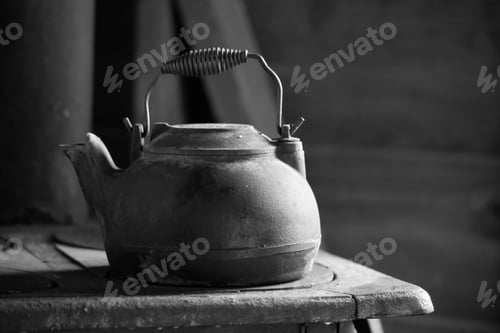 Preview: Metal Kettle Sitting On A Wood Stove