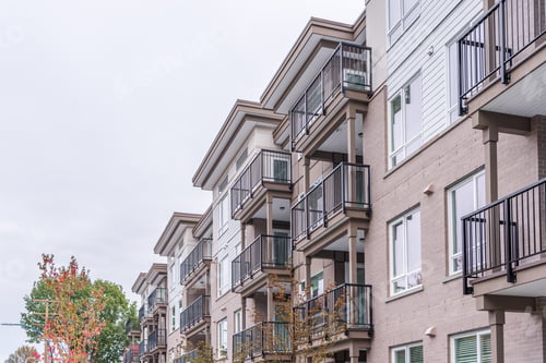 Preview: The Top Of An Apartment Building With Nice Windows.