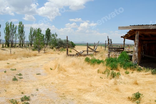 Preview: Landscape Of A Grass Covered Dirt Road Leads Past An Old Falling Apart Wooden Fence In The Rural