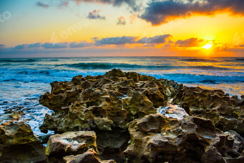 Preview: Background Of The Sunrise Over The Ocean As It Washes Over And Through The Limestone Rocks On A
