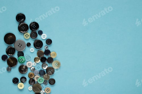 Preview: Multi Colored Clothes Sewing Buttons On Blue Background