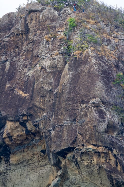 Preview: Playa Redonda, Nicaragua - January 21: Adventurous Tourists Rappelling Down A Cliff In Nicaragua