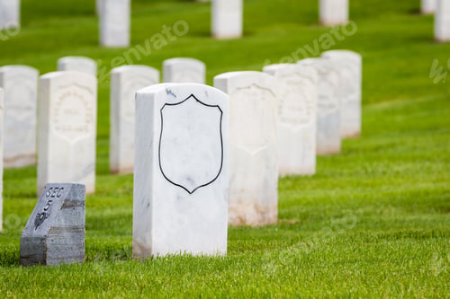 Preview: Rows Of Tombstones In A Military Graveyard With Bright Green Spring Grass