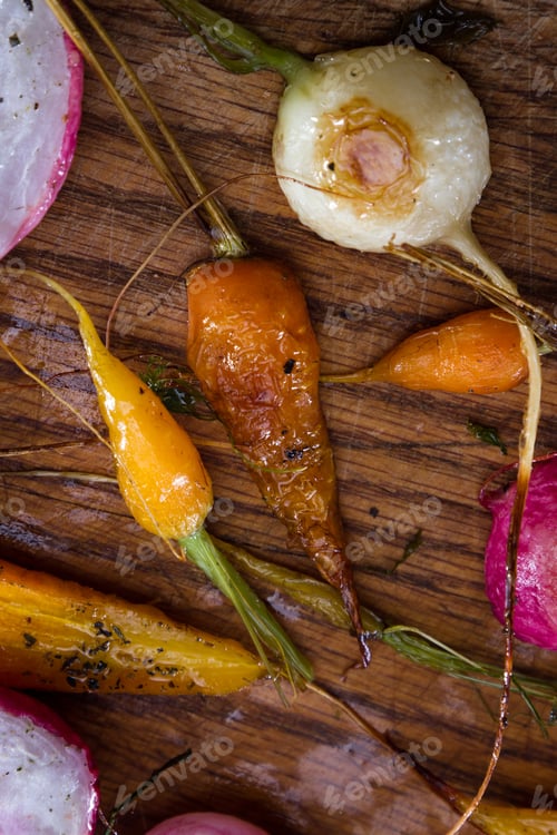Preview: Fresh Baby Carrots And Radishes Roasted And Seasoned With Oil And Spices