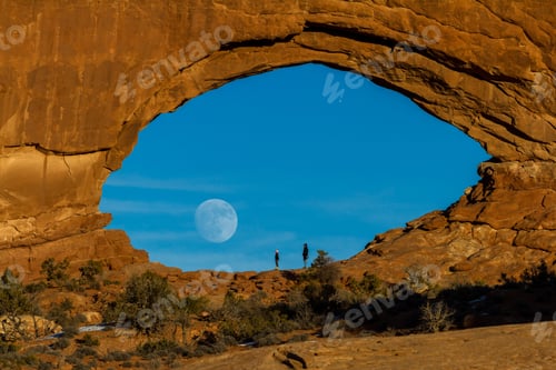 Preview: Arches Np, Utah - December 20: Tourists Enjoying The Full Moon Rising Thru North Window. December