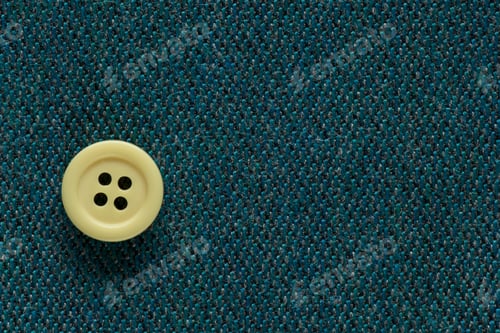 Preview: Clothes Sewing Button On A Blue Green Fabric Swatch Background
