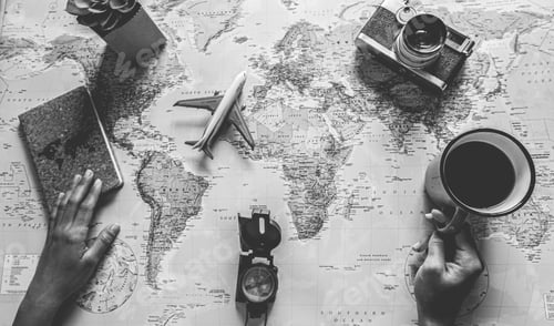 Preview: Young Woman Drinking Coffee And Planning World Tour With Vintage Travel Map - Girl Looking For A