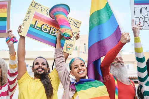 Preview: Gay People Having Fun At Pride Parade With Lgbt Flags And Banners Outdoors - Main Focus On Senior