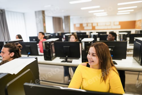 Preview: Young Students Using Computers Inside Technology Class At School Room - Soft Focus On Right Girl Eye