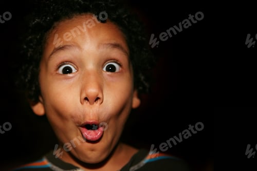 Preview: Portrait Of A Young Hispanic Kid With A Surprised Expression