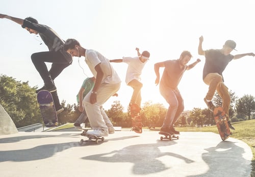 Preview: Skaters Jumping With Skateboard In City Suburb Park - Sporty Guys Performing Tricks And Skills At