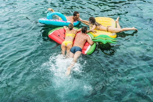 Preview: Happy Friends Having Fun Inside Inside Sea Natural Pool During Summer Vacation - Main Focus On