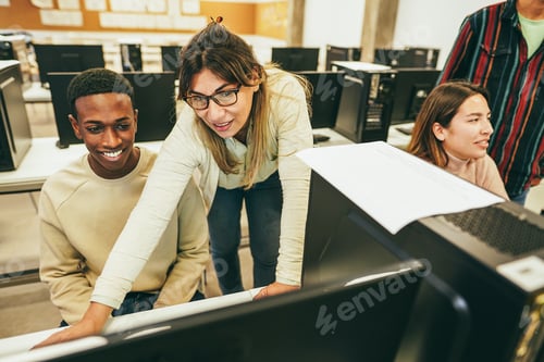 Preview: Teacher Working With Students Inside Computer Class Room - Focus On Mature Woman Face