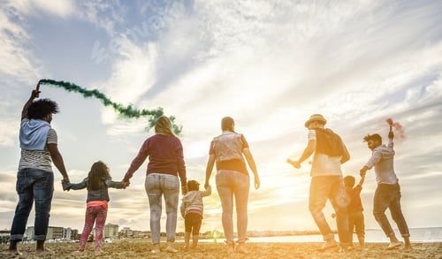 Preview: Families Friends Having Fun On The Beach With Smoke Bombs And Firework At Sunset - Diverse Culture