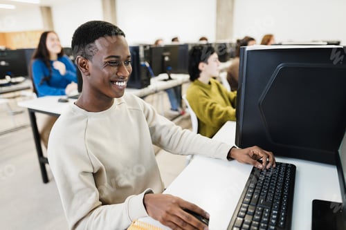 Preview: Young African Student Using Computer Inside College Room At School University - Focus On Face