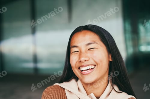 Preview: Young Asian Girl Smiling On Camera Outdoor - Focus On Face