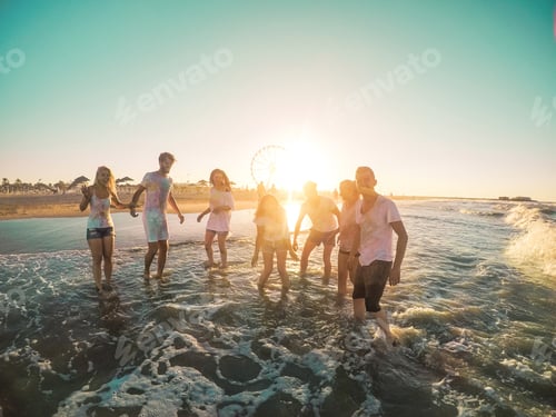 Preview: Happy Friends Having Fun On The Beach At Sunset - Young People Playing Inside Sea Water Outdoor In