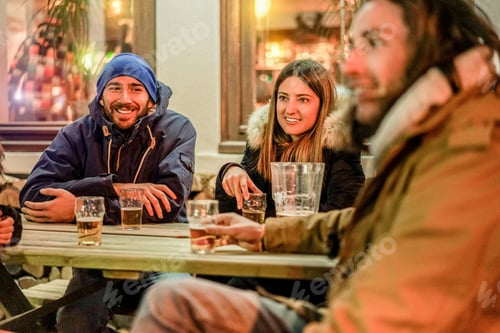 Preview: Happy Rich Friends Toasting Beers At Chalet Pub Restaurant In Mountains On Evening Time - Young