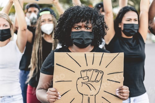 Preview: Multiracial People Protest On The Street For Equal Rights - Focus On Banner