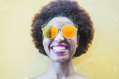 Preview: Smiling Woman with Afro and Orange Sunglasses