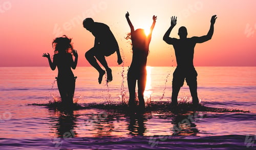 Preview: Happy Friends Jumping Inside Water On Tropical Beach At Sunset - Group Of Young People Having Fun