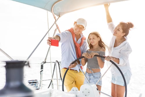 Preview: Happy Family Doing Luxury Sailboat Trip - Father, Mother And Daughter Doing Selfie Photo While