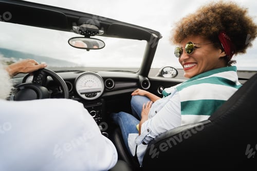 Preview: Senior Trendy Couple Inside A Convertible Car On Holiday Time - Focus On Woman Face