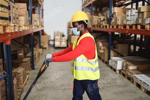 Preview: African Warehouse Worker Loading Delivery Boxes While Wearing Safety Mask - Focus On African Man