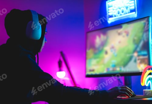 Preview: Young Gamer Playing At Strategy Online Game - Male Guy Having Fun Gaming And Streaming Online - New