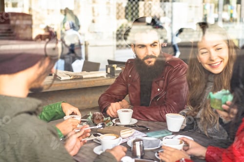 Preview: Group Of Friends Enjoying Cappuccino And Latte Macchiato Together In A Coffee Shop - View Through