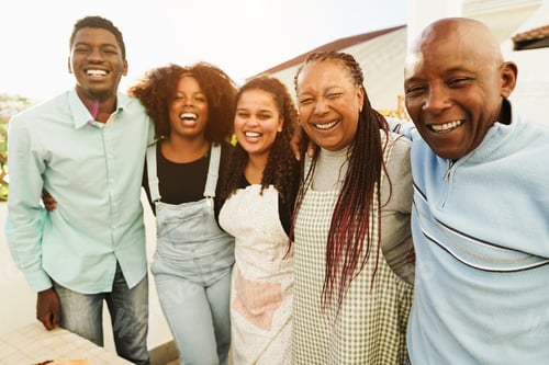 Preview: Happy African Family Cooking Together In Outdoor Kitchen At Home - Focus On Senior Woman Face