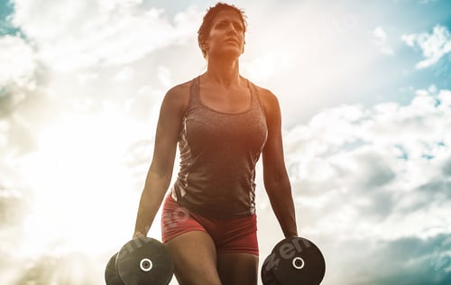 Preview: Female Athlete Doing Workout Session Outdoor At Sunset - Fitness Woman Working With Dumbbells