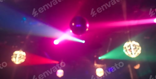 Preview: Blurred Colorful Laser Lights With Vintage Disco Ball - Defocused Image -Concept Of Nightlife With
