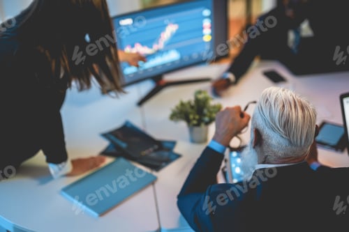 Preview: Business Trader People Talking About New Trading Strategies Inside Bank Meeting Room - Focus On