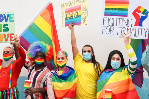 Preview: Mutiracial People Protest At Gay Pride Event With Banners And Lgbt Rainbow Flags Wearing Protective