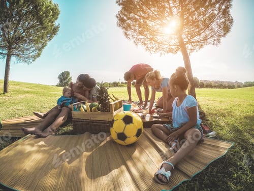 Preview: Happy Families Preparing Picnic In Park Outdoor - Young Parents Having Fun With Children In Summer