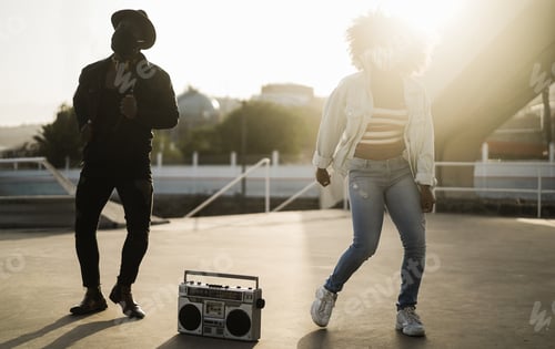 Preview: African Friends Dancing Outdoors Listening Music While Wearing Safety Masks - Main Focus On Boombox
