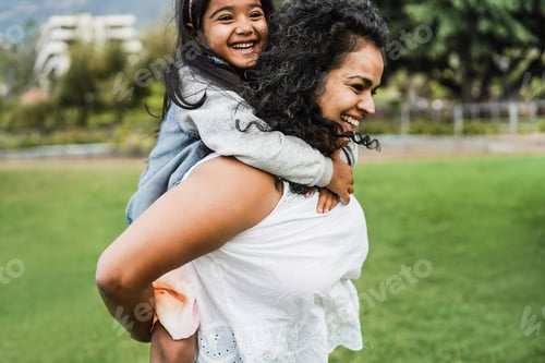Preview: Happy Indian Mother Having Fun With Her Daughter Outdoor - Main Focus On Mum Arm