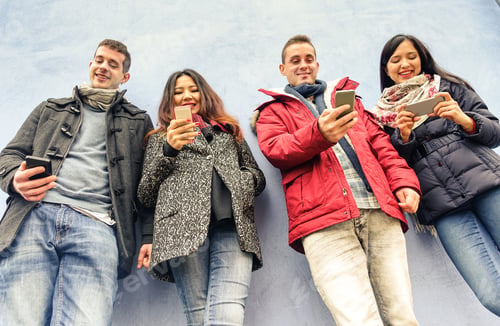 Preview: Group Of Young Friends Looking Their Smartphones In Old Town Center - Smiling People Having Fun