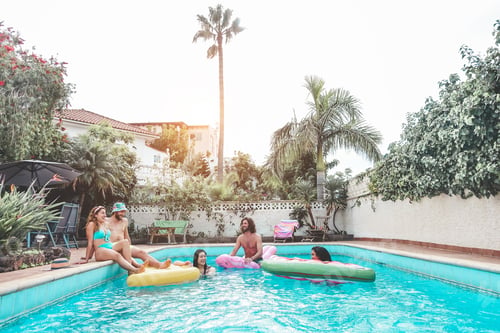 Preview: Happy Friends Floating With Air Lilo Mattress At Swimming Pool Party - Young People Having Fun On