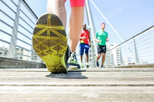 Preview: Close Up Of Woman Legs Running With Friends In Urban Wood City Bridge - Young People Doing Jogging