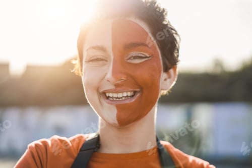Preview: Orange Sport Fan Smiling At Camera Out Of The Stadium Before Football Match - Main Focus On Right