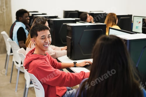 Preview: Young Students Using Computers Inside Technology Class At School Room - Focus On Asian Guy Face