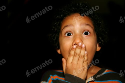 Preview: Portrait Of A Young Hispanic Kid With A Amazement Expression