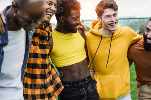 Preview: Young Diverse Men Hugging Each Other At City Park - Focus On Guy Face Wearing Yellow Sweater